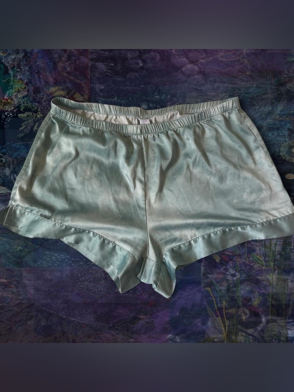 satin light green/blue stars above pajama shorts